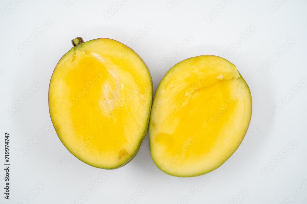 Cut mango close up on white background isolated.