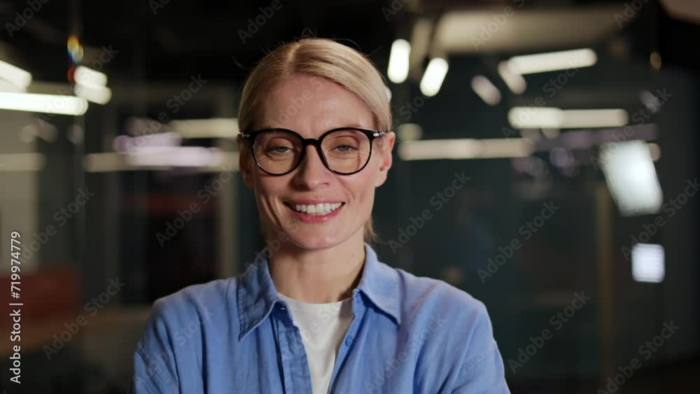 Pretty woman with beautiful facial feature standing in spacious business center. Smiling female dressed in casual attire and glasses exuding attractive and composed behave while looking at camera. Pretty woman with beautiful facial feature standing in spacious business center. Smiling female dressed in casual attire and glasses exuding attractive and composed behave while looking at camera.