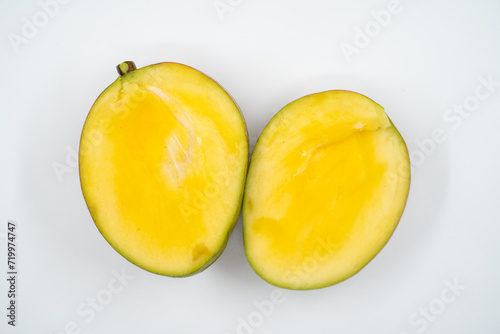 Cut mango close up on white background isolated.