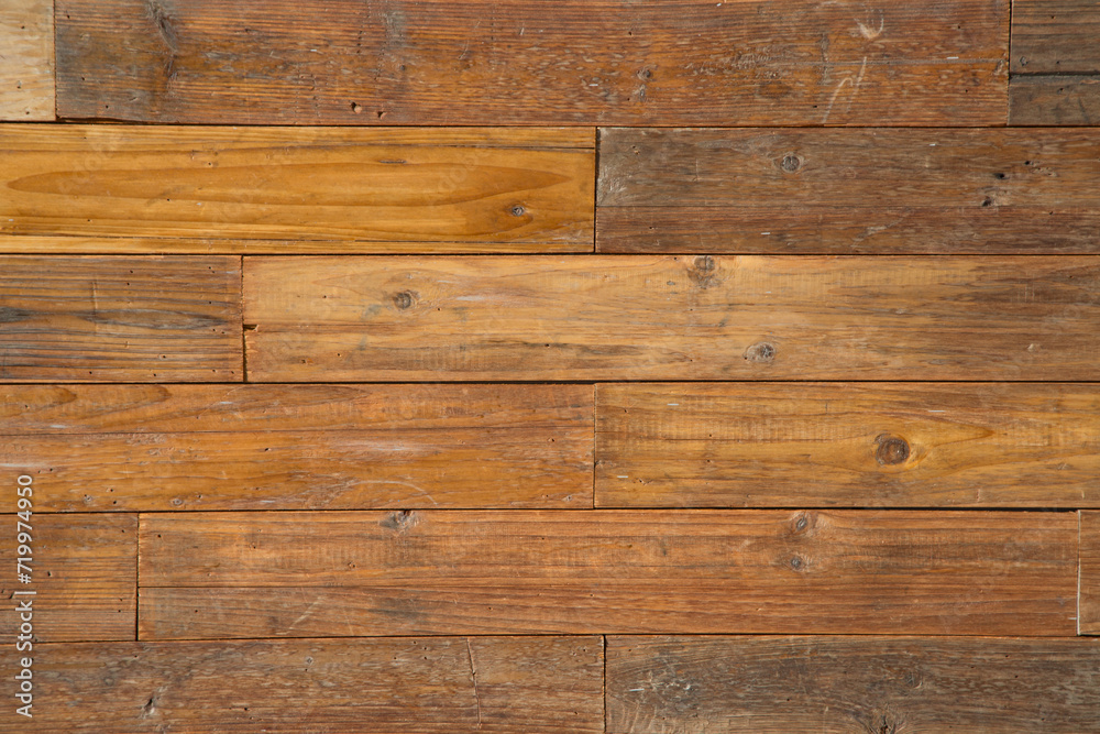 Naklejka premium wooden board wall adorned with wooden decorations