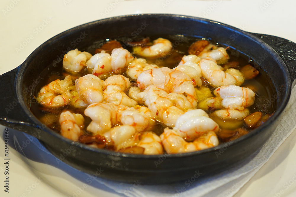 Close up Gambas al Ajillo, Spanish Garlic Shrimp with olive oil and dried chili- Classic Tapas
Close up Gambas al Ajillo, Spanish Garlic Shrimp with olive oil and dried chili- Classic Tapas