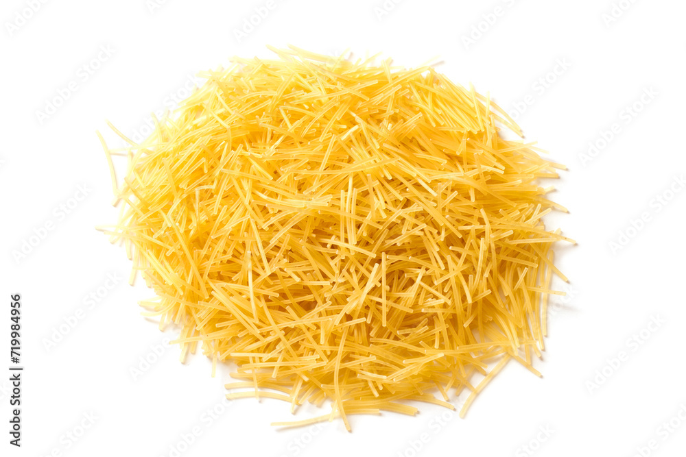 A pile of small noodles on a white background. Raw pasta isolated close-up.