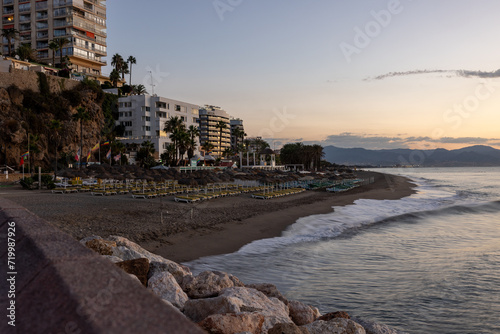  View of promenade and Bajondillo beach in Torremolinos just before sunrise. Costa del Sol, Spain photo