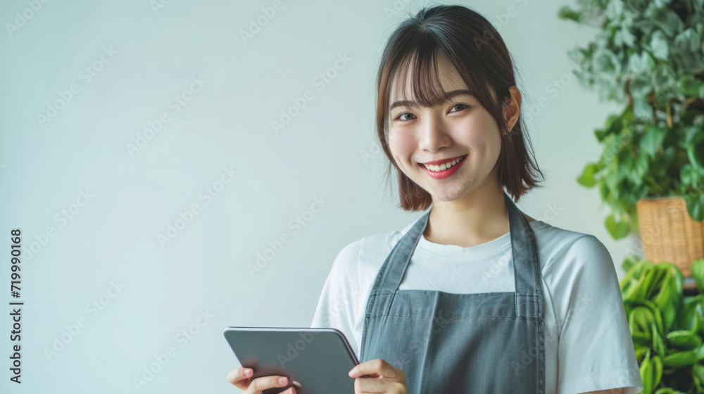 young smiling welcome asian female woman business owner wear apron hand holding tablet ready for your order on white color background, restaurant, pretty, uniform young smiling welcome asian female woman business owner wear apron hand holding tablet ready for your order on white color background, restaurant, pretty, uniform