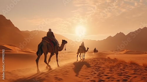 People riding camels in the desert for travel © Zidane