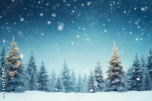 Blurred background of Christmas snowy fir trees with copy space.Merry Christmas and happy New Year greeting background