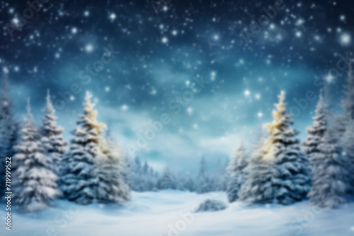 Blurred background of Christmas snowy fir trees with copy space.Merry Christmas and happy New Year greeting background © erika8213