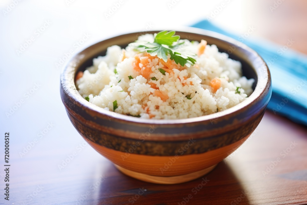 lowcarb cauliflower rice in a ceramic bowl lowcarb cauliflower rice in a ceramic bowl