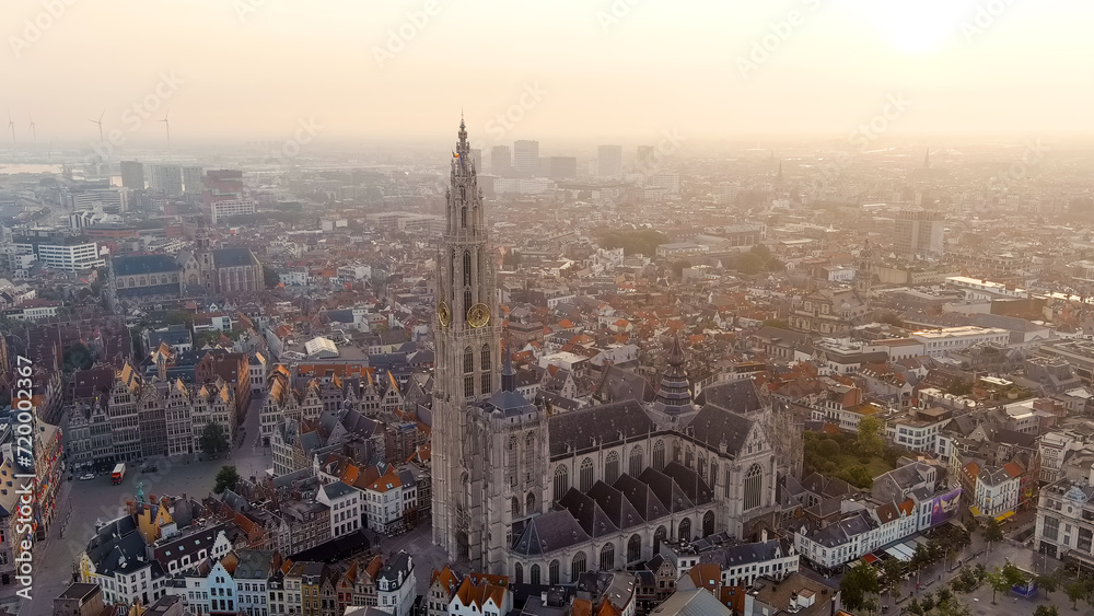 Antwerp, Belgium - July 21, 2023: Spire with the clock of the Cathedral of Our Lady (Antwerp). City Antwerp is located on river Scheldt (Escaut). Summer morning, Aerial View