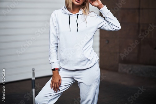 Portrait of a Young Girl in a White Hoodie. A Template for Clothing Mock-up and Graphic Print