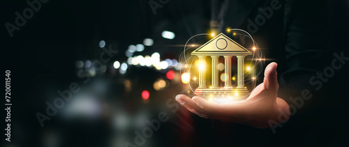 Businessman holding bank and technology with global network connection Facilitating the growth of the banking sector financial institution and businesses driven by technology with copy space photo