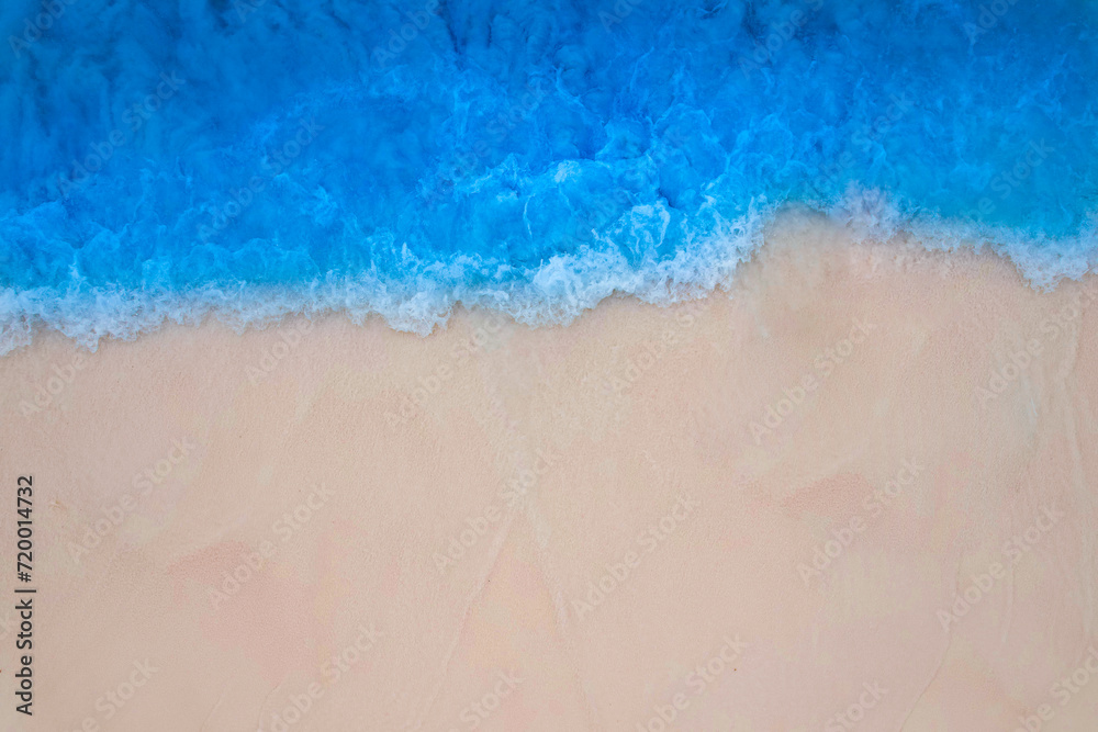 Beach sand for summer vacation concept. Beach nature and summer seawater with sunlight light sandy beach Sparkling sea water contrast with the blue sky.Beach sand for summer vacation concept.	