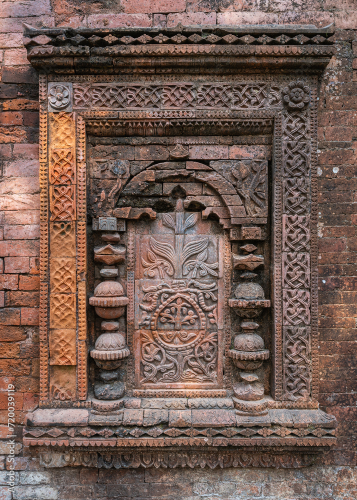 Detail vertical view of beautiful brick and terracotta decor on ancient medieval Khania Dighi mosque exterior wall, Shahabazpur, Chapai Nawabganj, Bangladesh