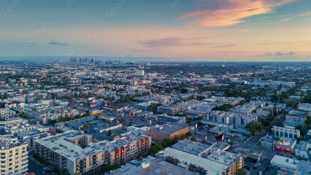 Aerial hyperlapse of Hollywood skyline, revealing city of Los Angeles cityscape at sunset. Aerial hyperlapse of Hollywood skyline, revealing city of Los Angeles cityscape at sunset.