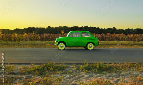 retro car near a private house on the road. Sunset. Bright car. Round headlights. High quality photo © Vitalii