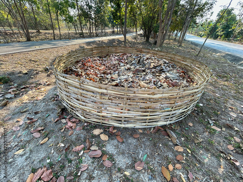 Big bamboo basket for pile of leaves before bushfire season in rural asian.