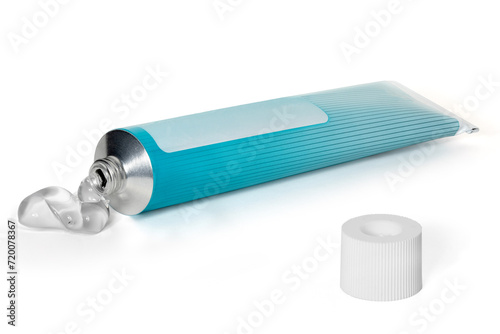 Tube of white and blue color with open cap on a white background. Full depth of field. With clipping path