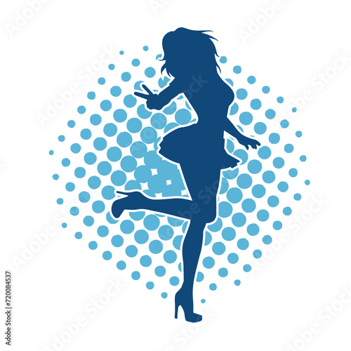 Silhouette of a female dancer wearing mini skirt in action pose. Silhouette of a slim woman dancing happily.
