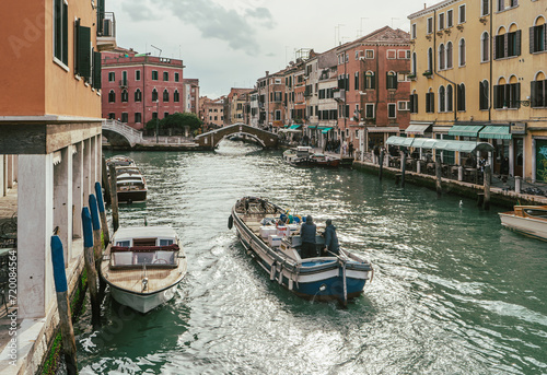 Channel in Venice - boats and bridges © Dmitry Kovalchuk