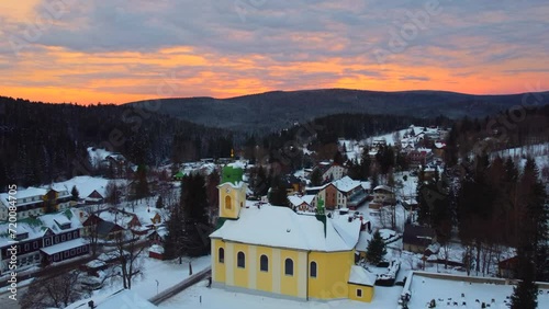 Sunrise over the Kostel sv. Vaclava,  church in Harrrachov town, Czech Republic. photo