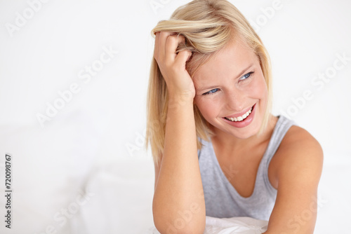 Woman, wake up and happy thinking on bed in home with ideas for morning and excited for future. Healthy, person and girl relax in bedroom on holiday, vacation or wellness from rest in apartment