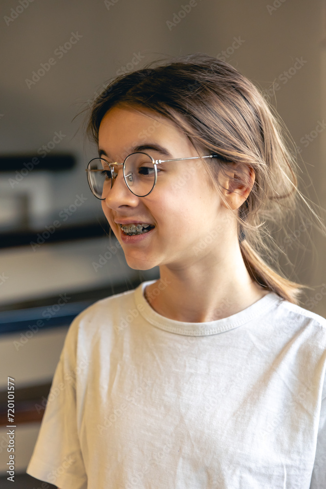 Portrait of a teenage girl with glasses and braces. Portrait of a teenage girl with glasses and braces.