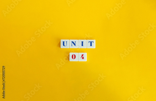 Unit 4. Text on Block Letter Tiles and Icon on Flat Background. Minimalist Aesthetics.