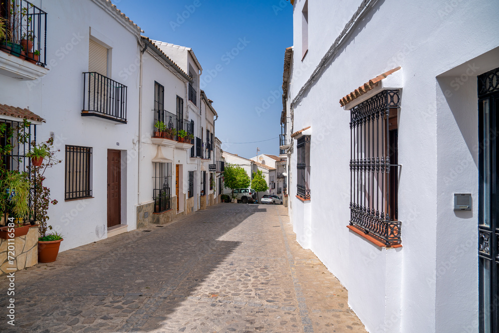 Zahara de la Sierra, Spain - April 9, 2023: Beautiful medieval city streets and white homes of the Pueblo Blanco