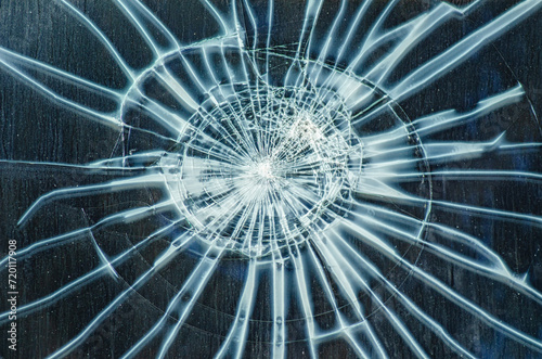 detail of an impact on a window glass, broken glass pane