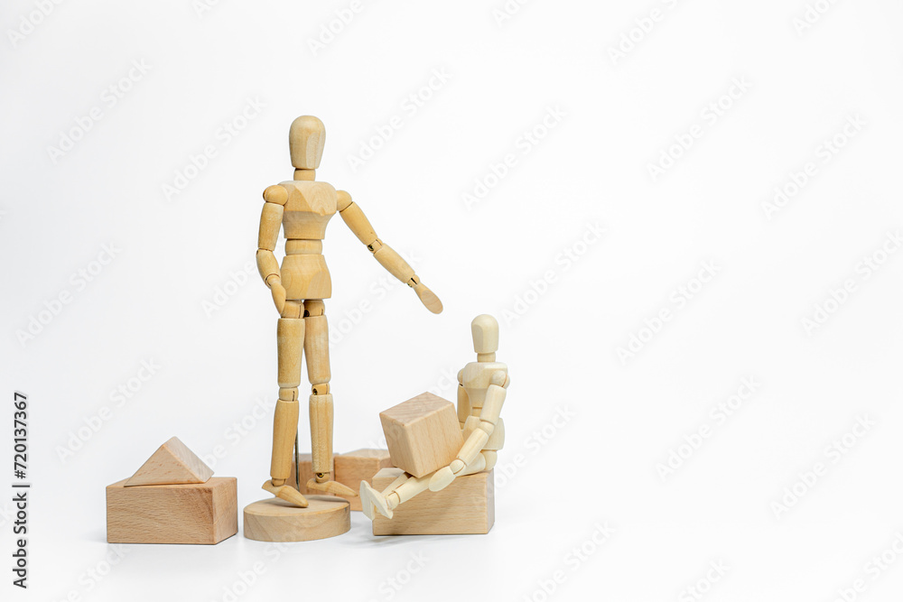 Wooden doll with wooden toy block isolated on white background. business or creative concept Wooden doll with wooden toy block isolated on white background. business or creative concept
