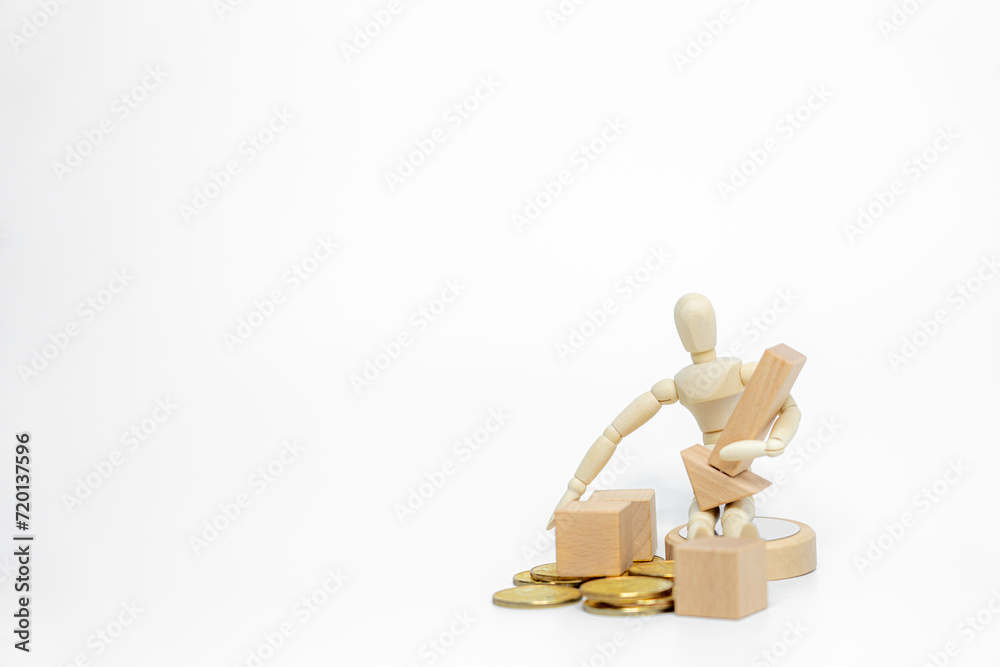 Wooden doll with wooden toy block isolated on white background. business or creative concept Wooden doll with wooden toy block isolated on white background. business or creative concept