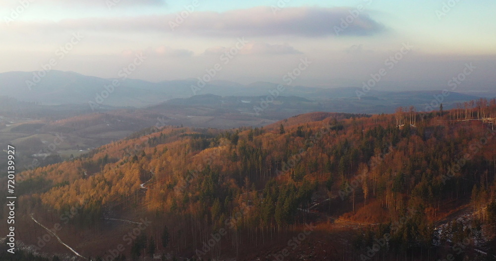 aerial view of woods and mountains in winter