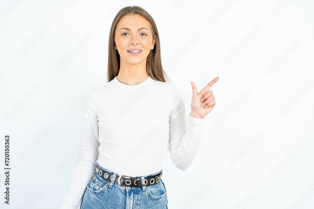 Young beautiful woman pointing up with fingers number eight in Chinese sign language BÄ. Young beautiful woman pointing up with fingers number eight in Chinese sign language BÄ.