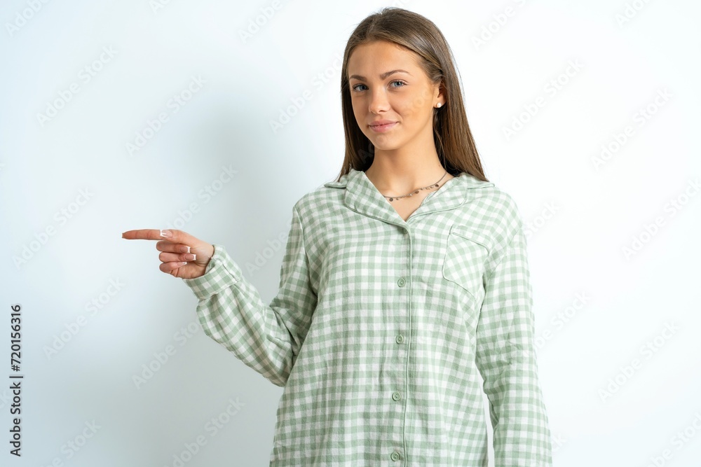 MODEL points to side on blank space demonstrates advertisement. People and promotion concept MODEL points to side on blank space demonstrates advertisement. People and promotion concept