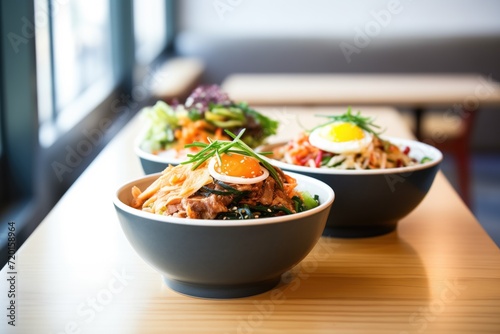 bowls of korean bibimbap ready for lunchtime customers photo