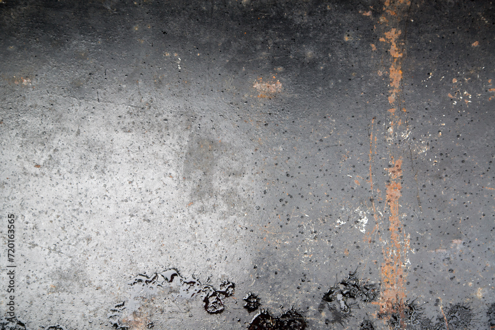 Weathered iron wall with seamless background of iron products Weathered iron wall with seamless background of iron products