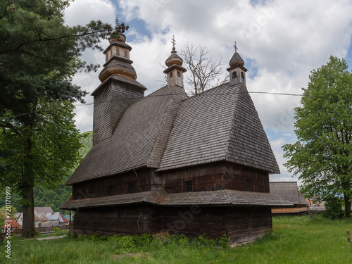Ancient baroque wooden church with tower in village Kolochava, Ukraine