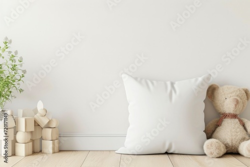 ozy children's room with a plush teddy bear and a blank white cushion. photo