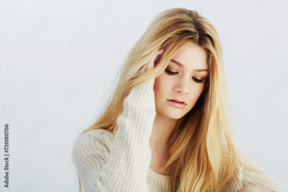 Naklejka premium Face, beauty and makeup with natural woman in studio on white background for style contemplation. Aesthetic, skincare or wellness with confident young blonde model in wool jersey for cosmetics
