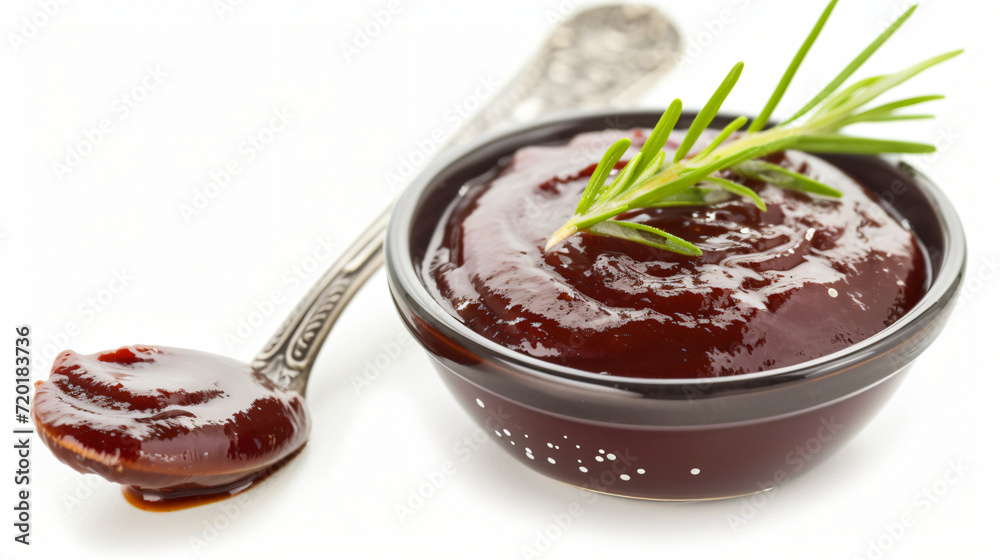 Barbecue sauce with spoon isolated on white background