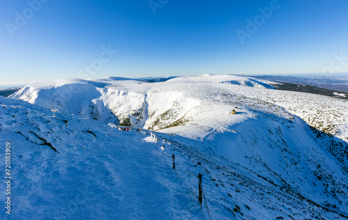 Winter mountain landscape with snow and clear blue sky. Panoramic view. The Giant mountains. © Martin