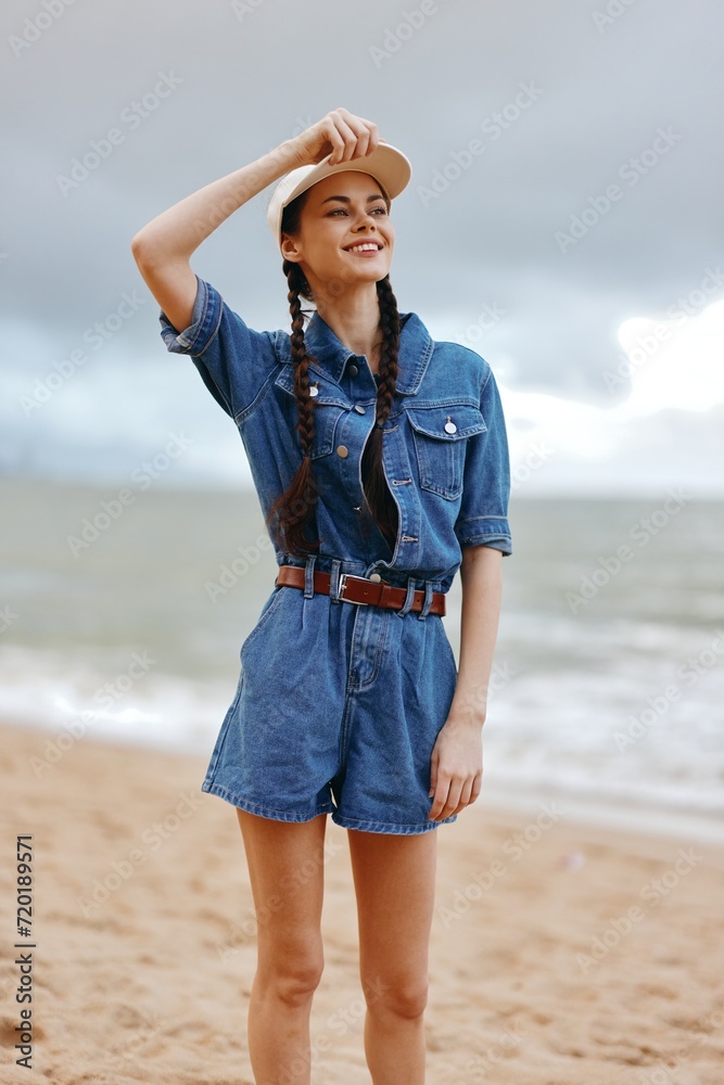 Summer Beauty: Pretty Young Female with Fashionable Hair, Sitting on a Beach, Enjoying a Tropical Vacation by the Blue Ocean