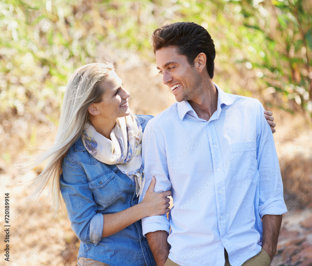 Happy couple, walking and hug in nature for bonding, love or support in relax for outdoor affection. Face of young woman and man with smile for embrace, comfort or romance in forest or woods together Happy couple, walking and hug in nature for bonding, love or support in relax for outdoor affection. Face of young woman and man with smile for embrace, comfort or romance in forest or woods together