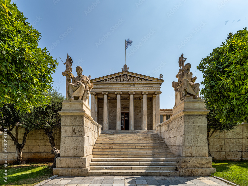 Plato and Socrates marble statues, the ancient Greek philosophers on both sides of the stairs leading to the national university of Athens. Cultural travel in Greece.