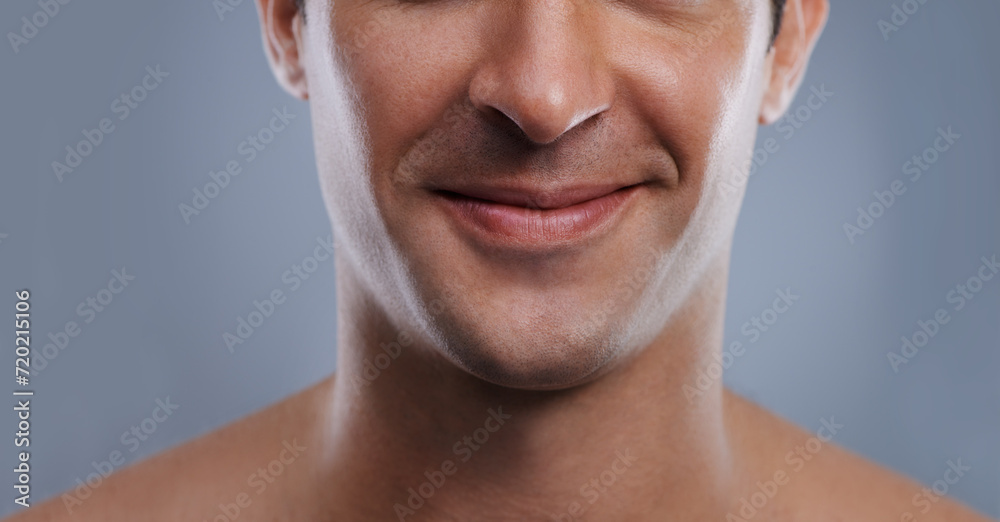 Man, mouth and smile with skincare and lips with hygiene, jawline and satisfaction with treatment closeup. Grooming, confidence and face with male model in studio background for cosmetic shave