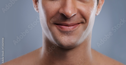 Man, mouth and smile with skincare and lips with hygiene, jawline and satisfaction with treatment closeup. Grooming, confidence and face with male model in studio background for cosmetic shave