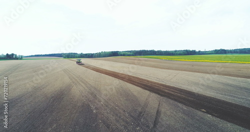 Tractor plowing field. Agriculture background.
