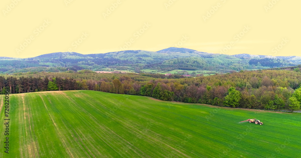 Farming. Agricultural tractor spraying field. Farming. Agricultural tractor spraying field.