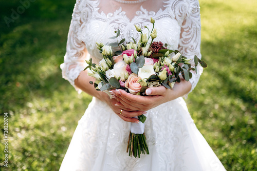 Wedding flowers. Bridal bouquet with exotic flowers. Bride holding a bouquet. wedding details. soft focus