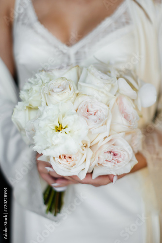 Wedding flowers. Bridal bouquet with exotic flowers. Bride holding a bouquet. wedding details. soft focus